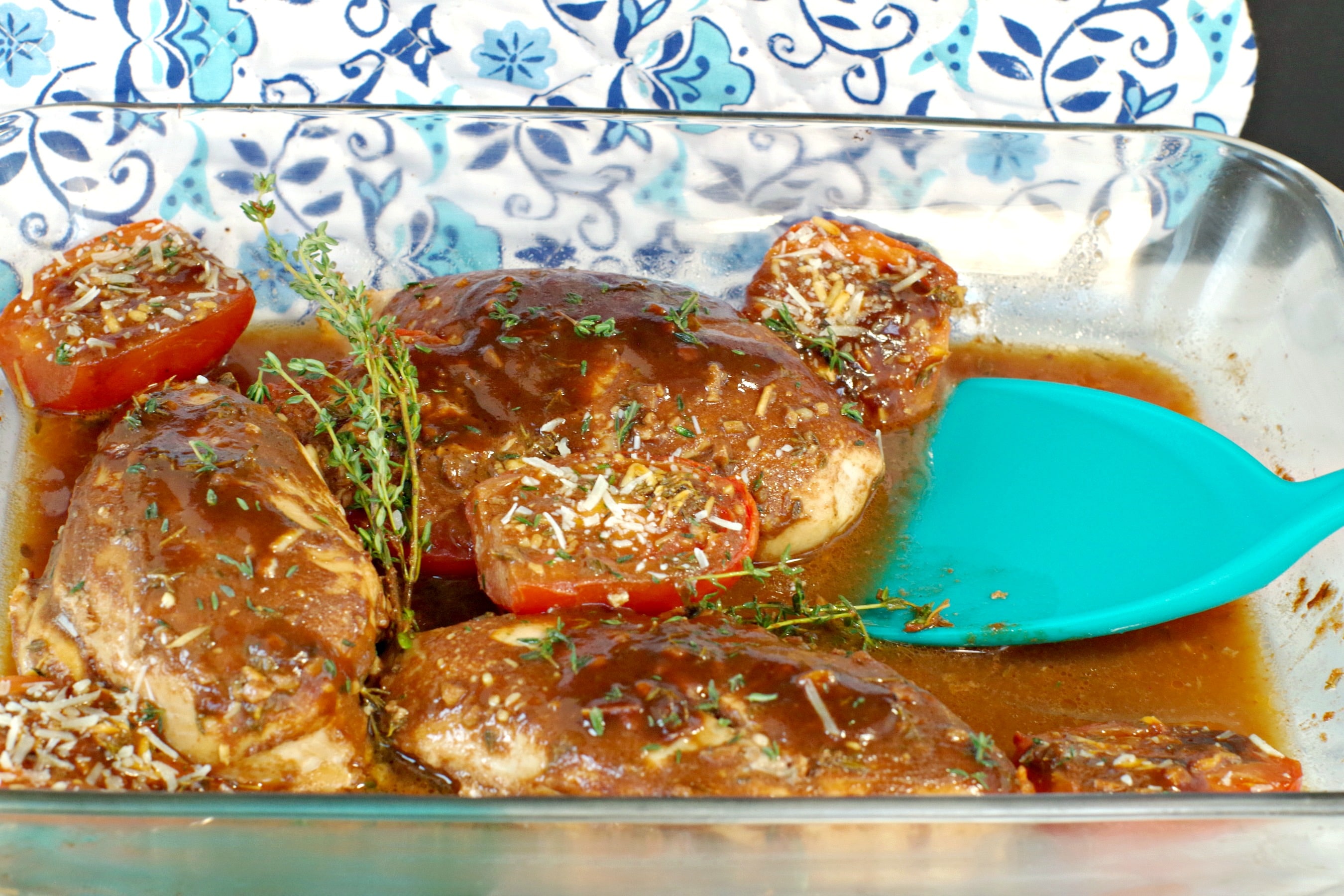 Balsamic chicken with tomatoes in a glass dish