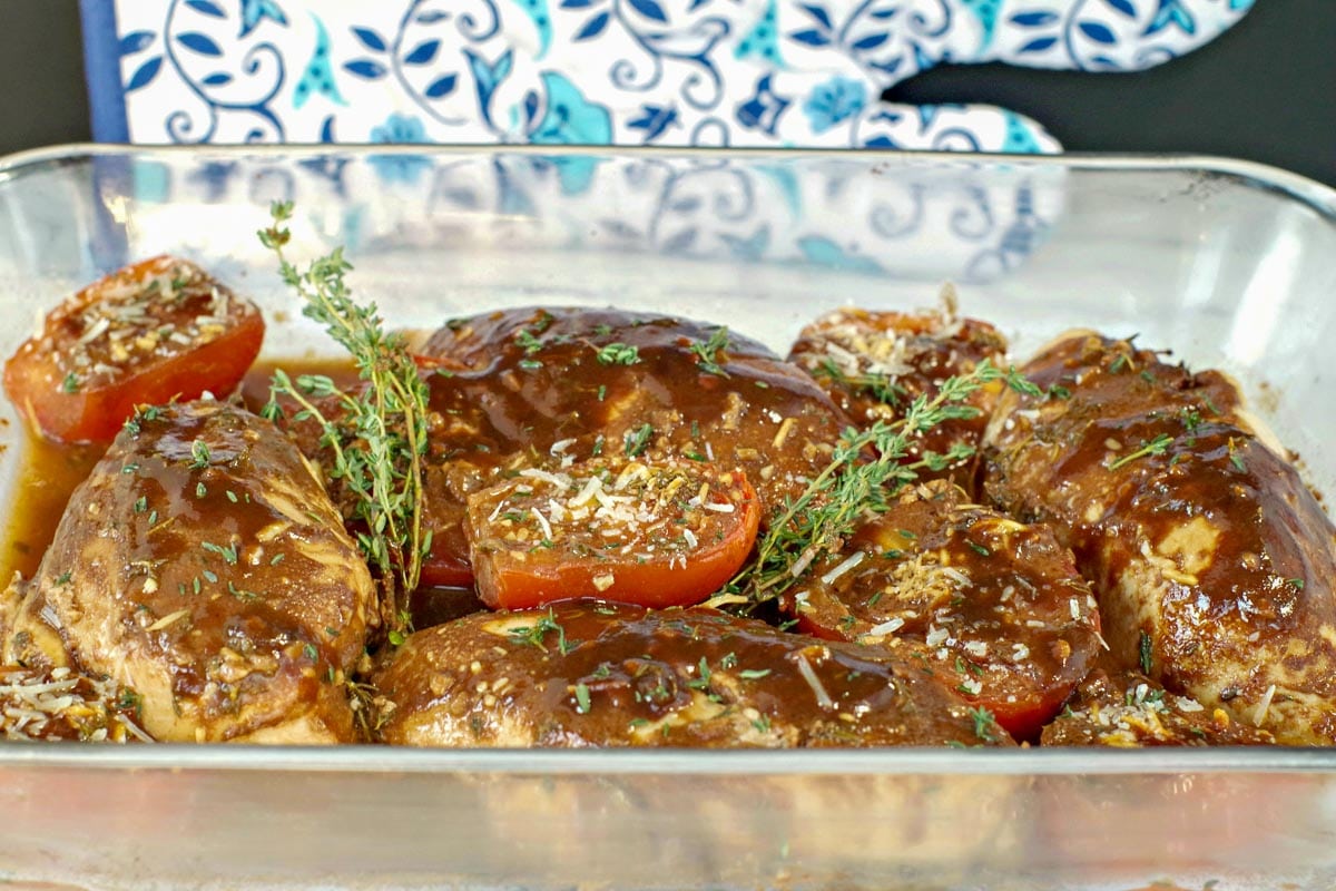 Balsamic chicken with tomatoes in a glass dish