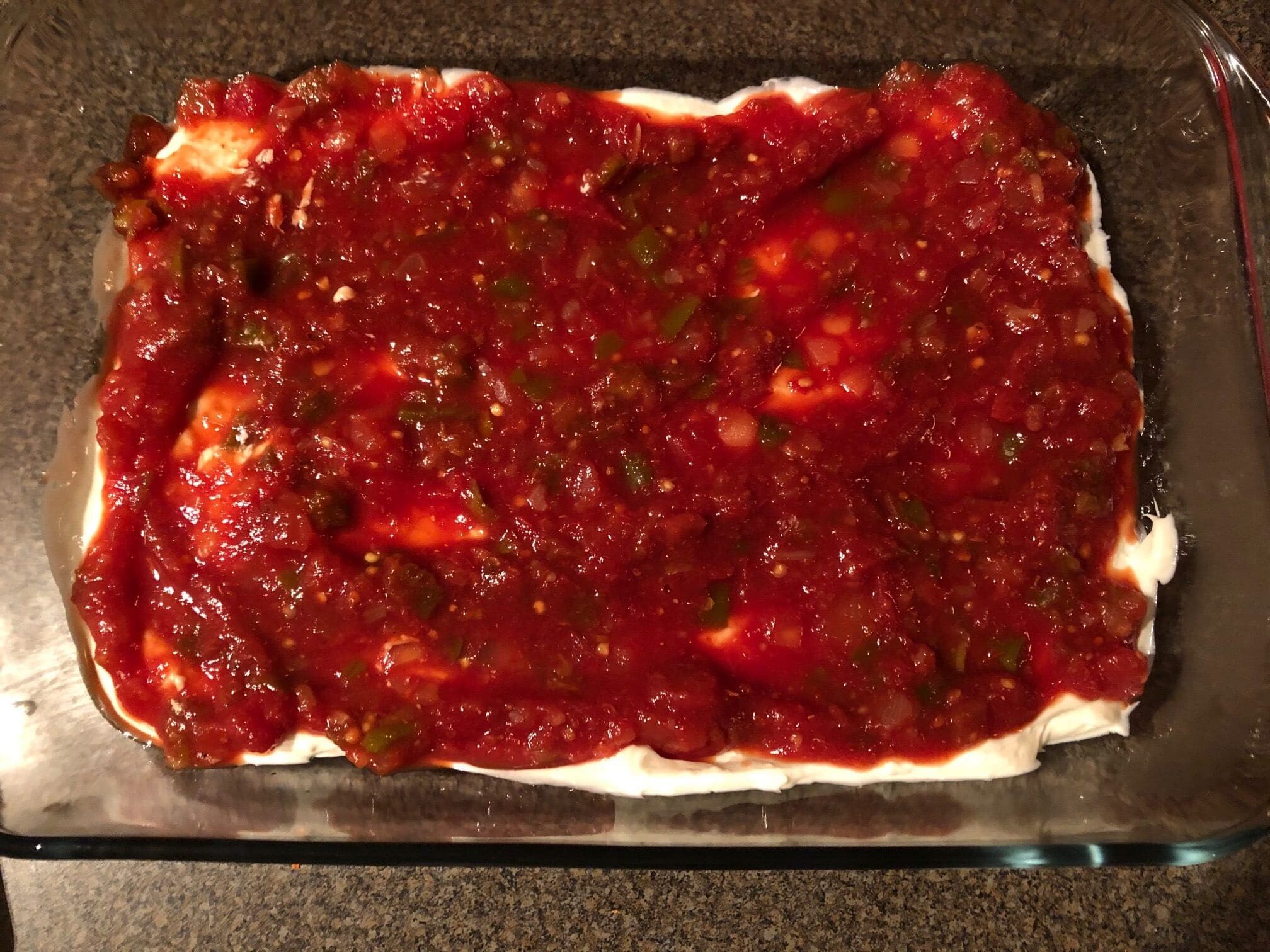 salsa spread on sour cream layer