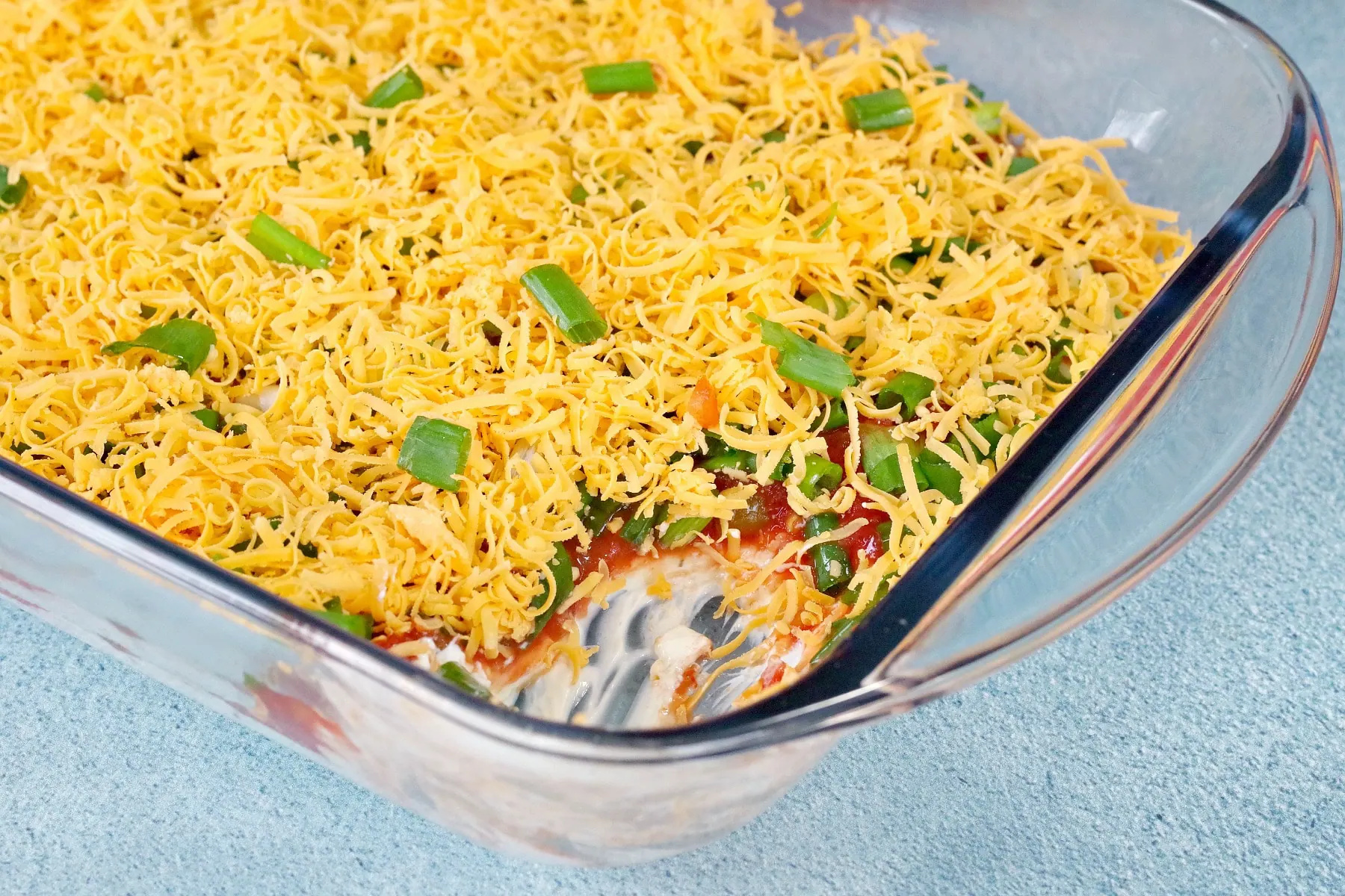 layered nacho dip with layers showing