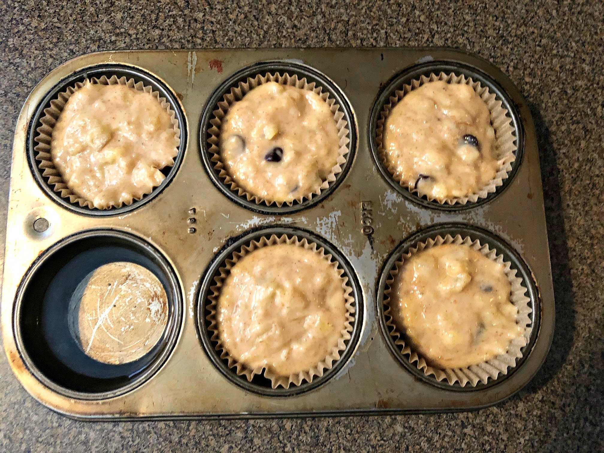 muffin tin with water added to one 