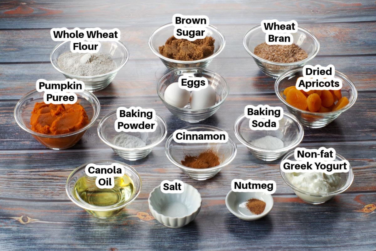 ingredients in healthy pumpkin bran muffins in glass bowls, labelled