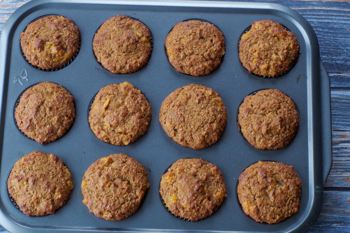 baked bran pumpkin muffins in muffin tin