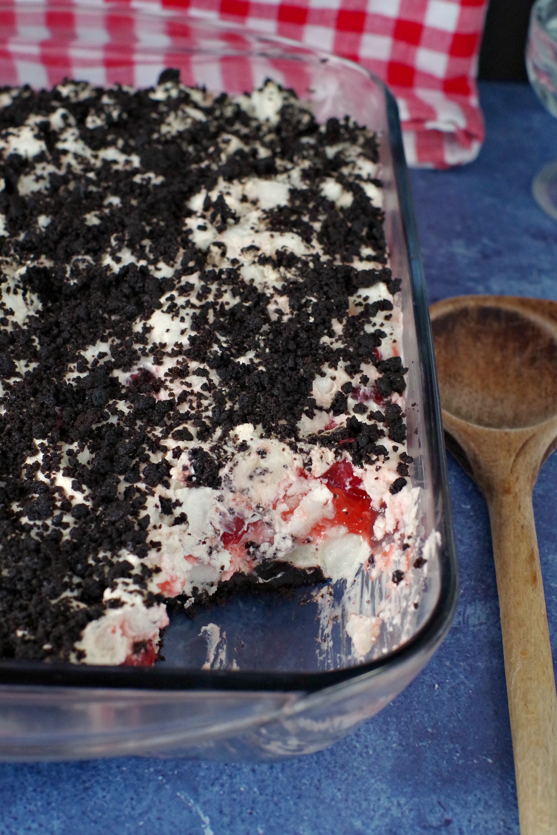 Cherry Cha Cha in a glass pan with a wooden spoon beside it