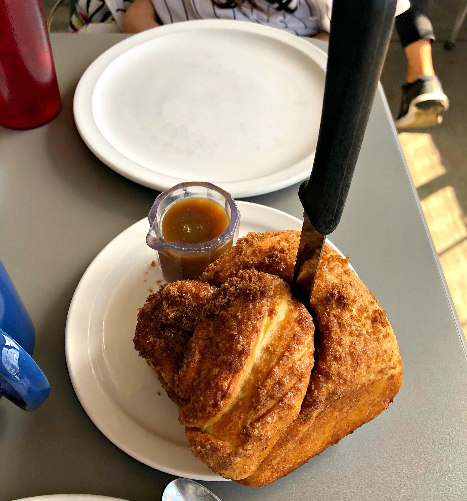 cinnamon bun with knife in it