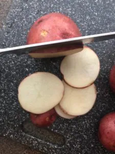 potato being sliced