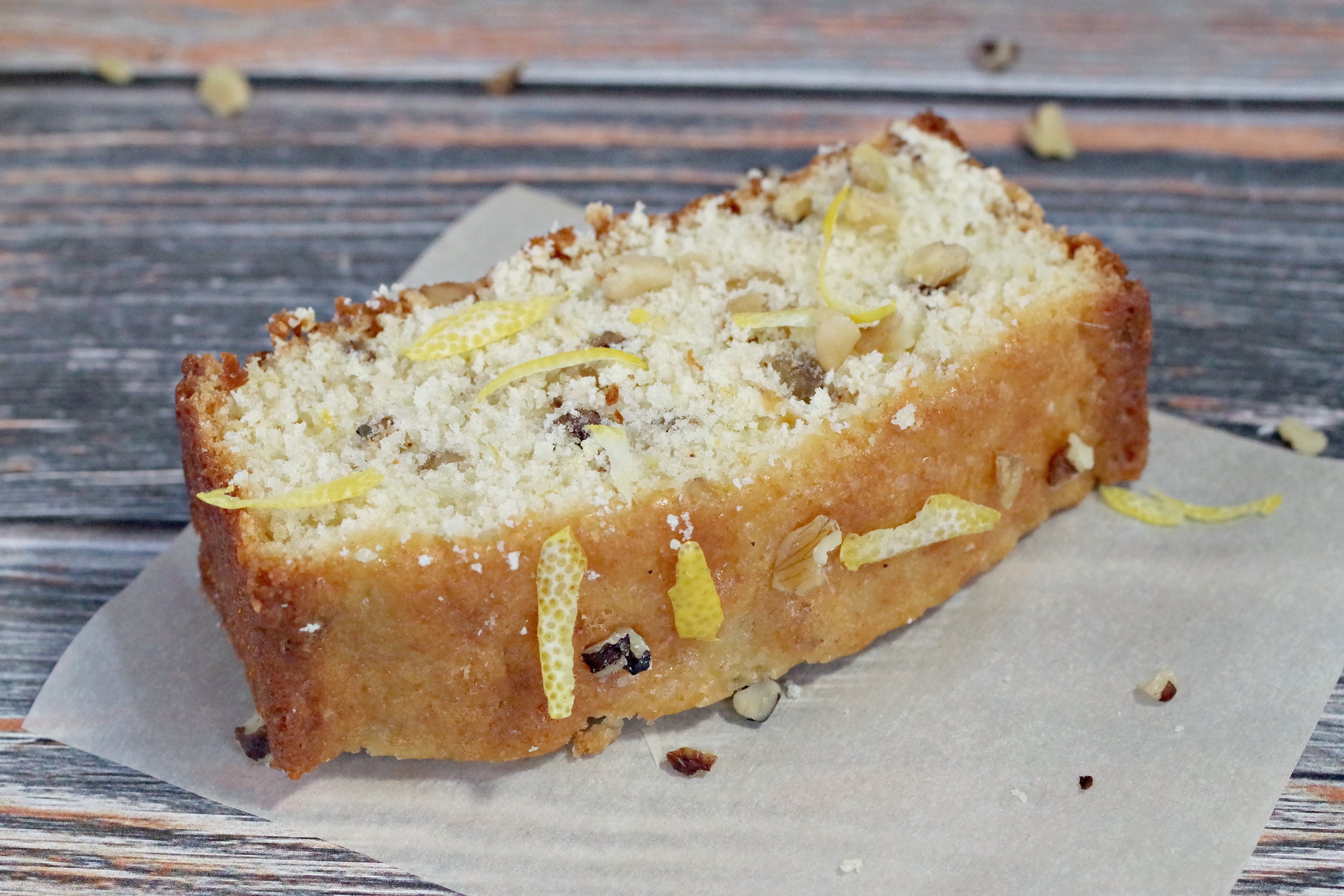 piece of lemon loaf on parchment paper