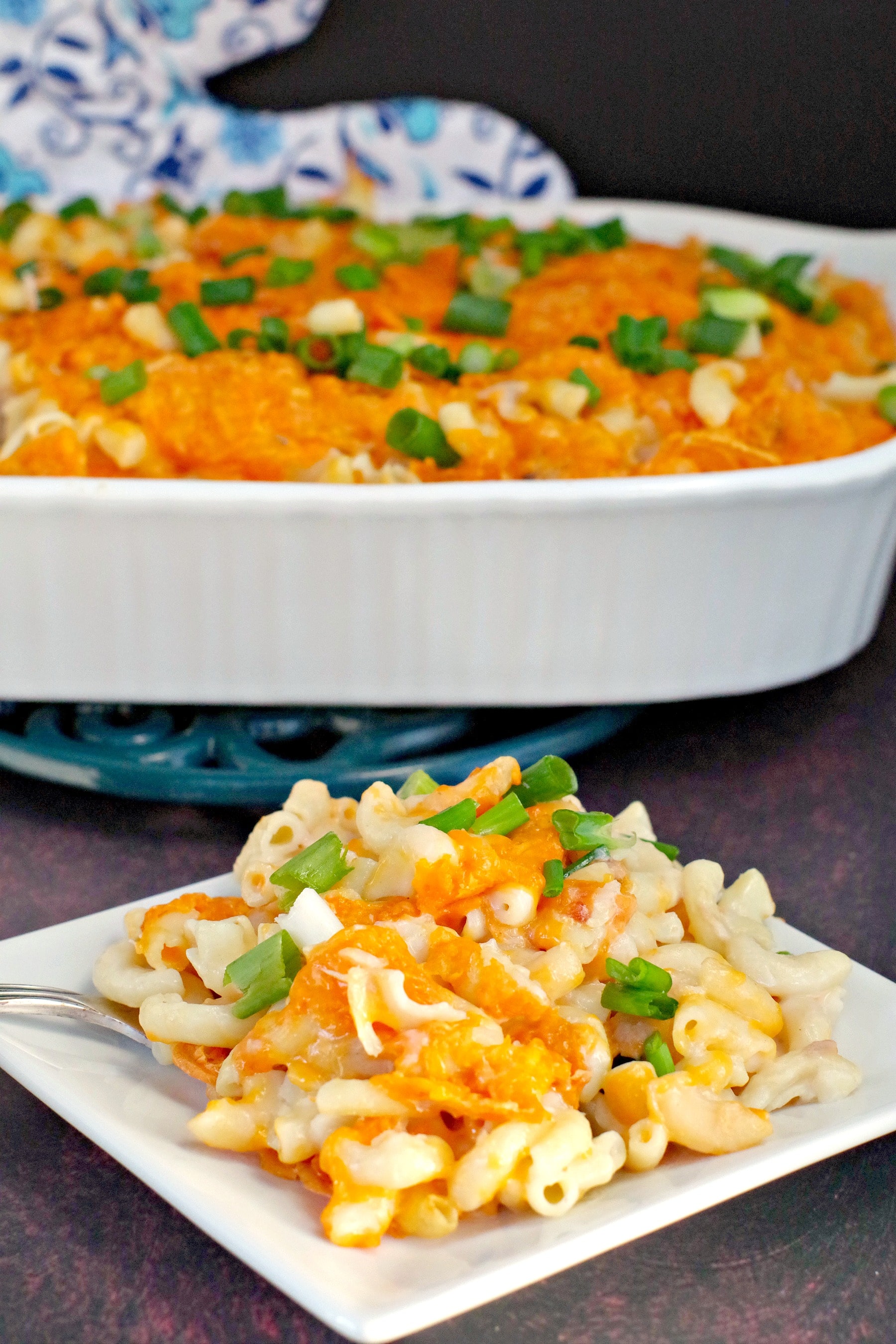 tuna casserole on white plate with casserole in background