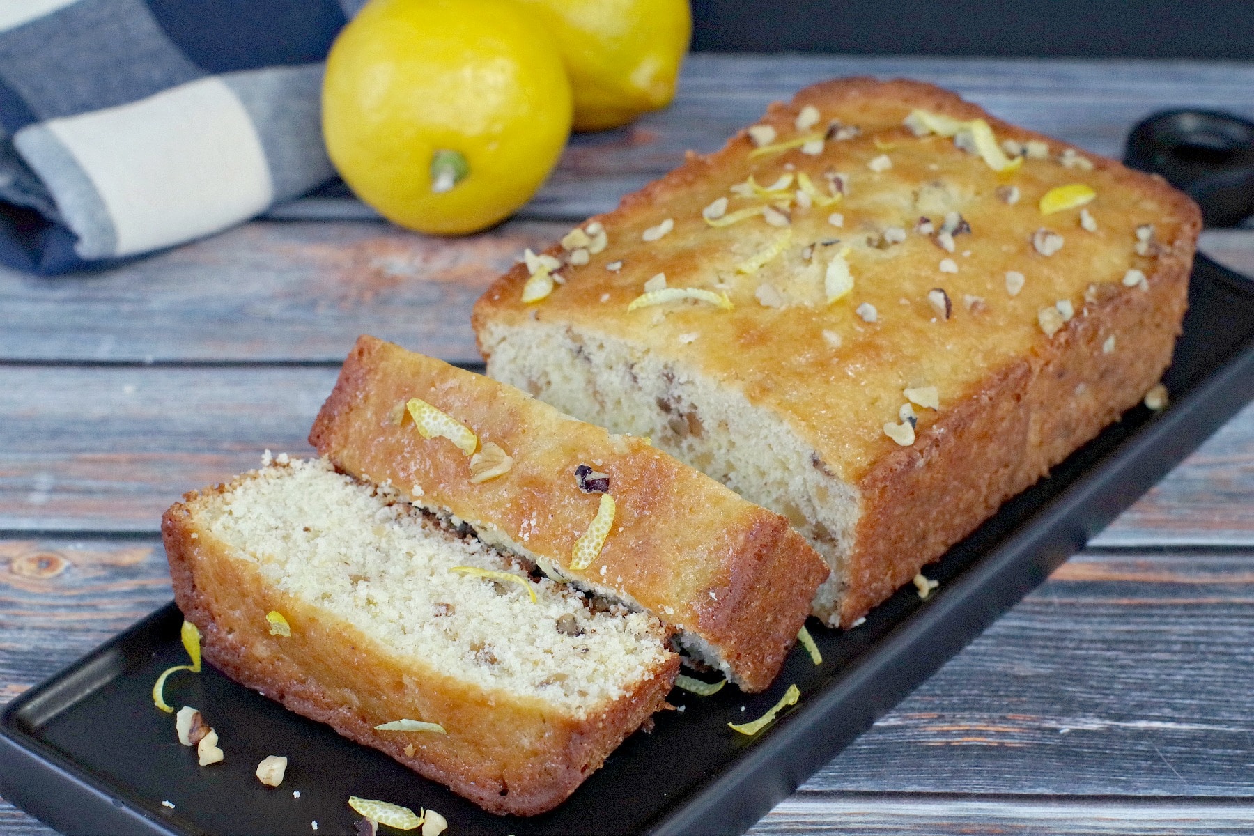 sliced lemon loaf on black tray