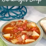 Pinterest Pin with white text on sage green background at top and bottom and photo of a bowl of hamburger soup in a lighter sage green bowl with a pot holder in the background