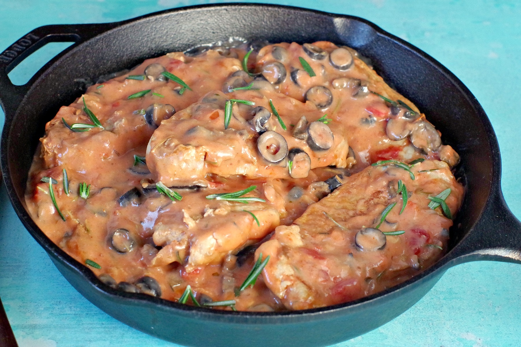 Pork with creamy mushroom salsa sauce in cast iron pan