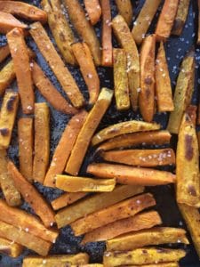 sweet potato fries cooked on baking sheet