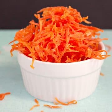 Candied carrots in a small white dish