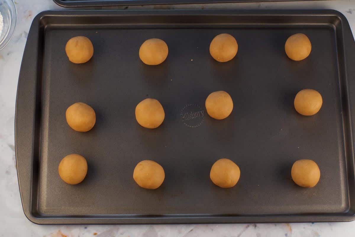 Dough formed into balls on ungreased cookie sheet