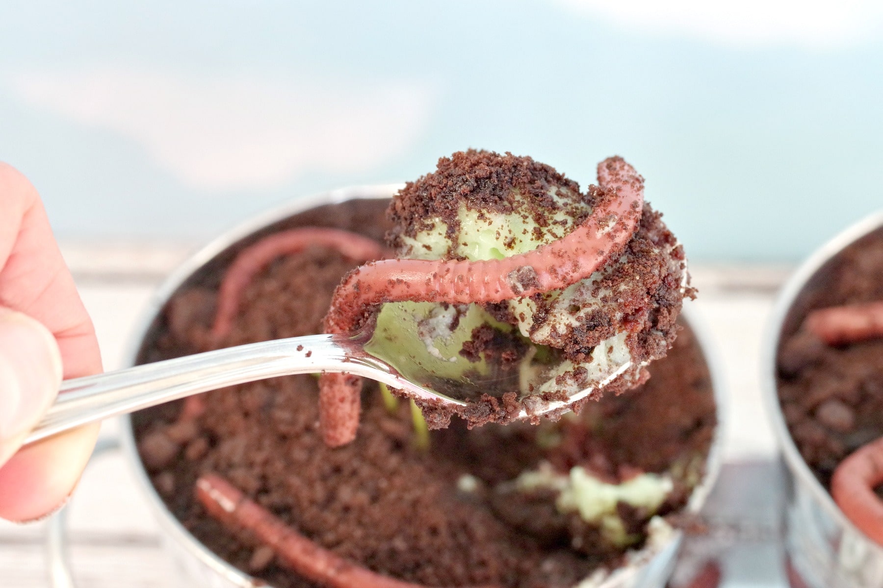 dirt and jello worms on a spoon