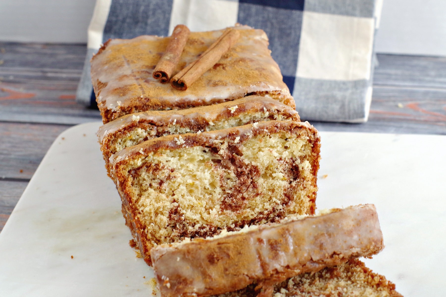 Sliced cinnamon swirl bread on a marble board