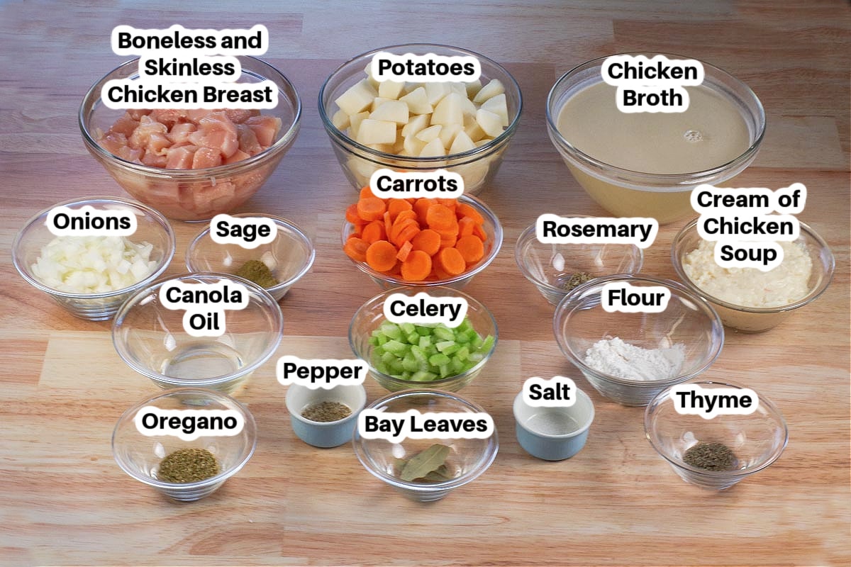 Slow Cooker Chicken Stew ingredients in glass bowls, labelled