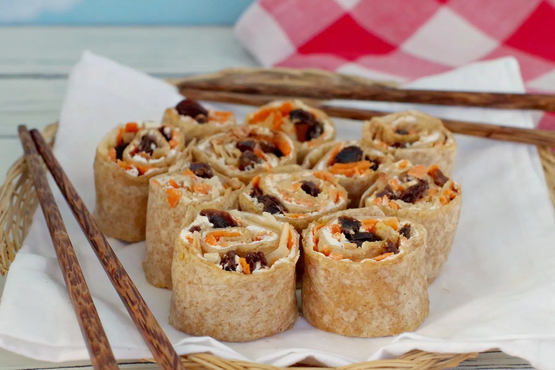 raisin sushi set up for a picnic with chopsticks