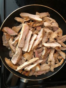 cooked pork in fry pan