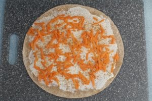 Carrot sprinkled on tortilla with cinnamon and cream cheese