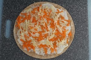 apples on tortilla with carrots, cream cheese and cinnamon