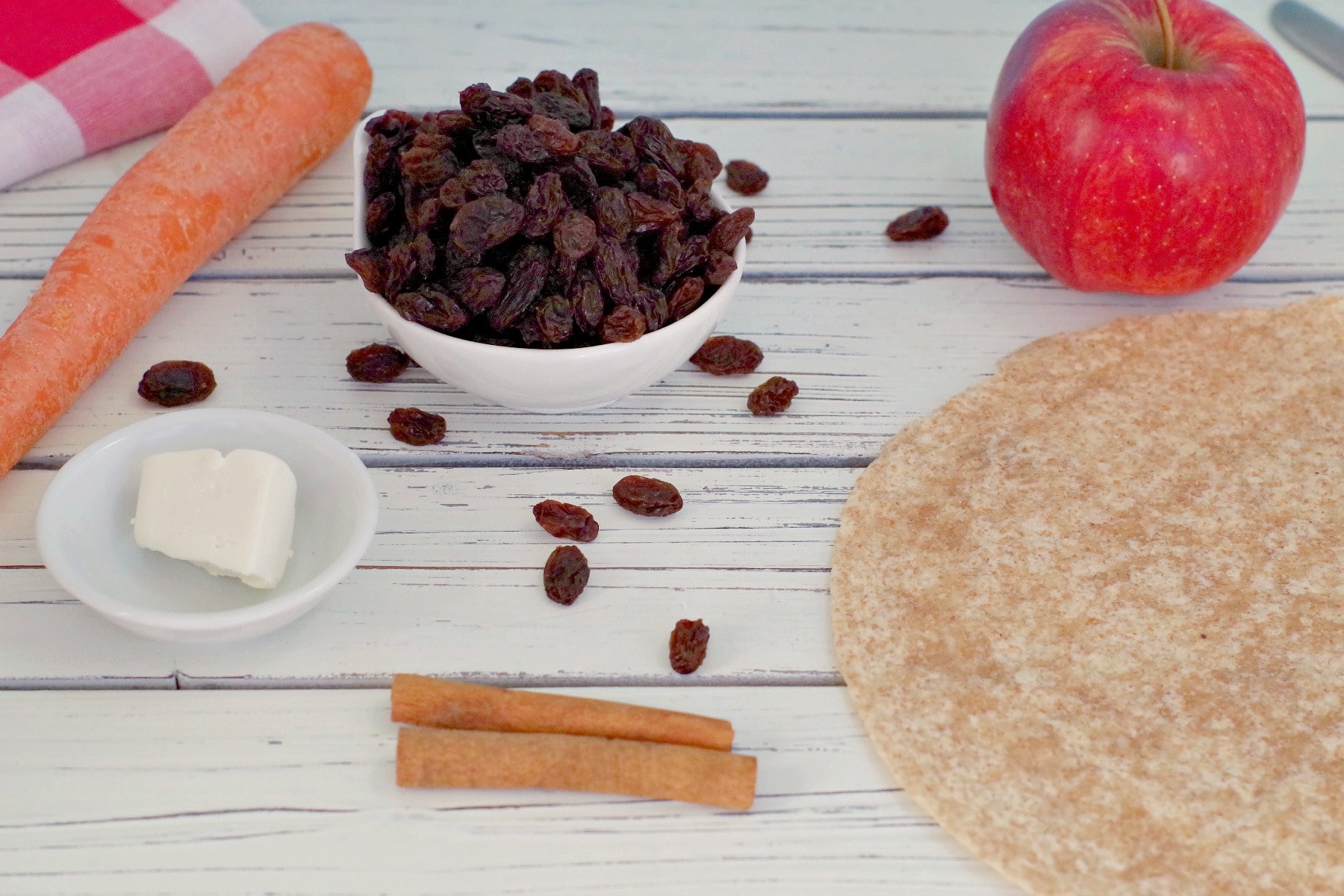 apple, raisins, cinnamon sticks, carrot, cream cheese and whole wheat tortillas