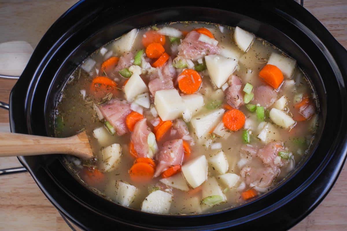 Cream of chicken soup and chicken soup broth added to crockpot