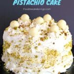 White Chocolate Pistachio cake on black stand