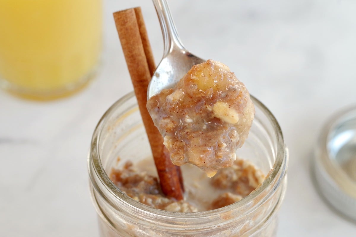 overnight oats being held up with a spoon