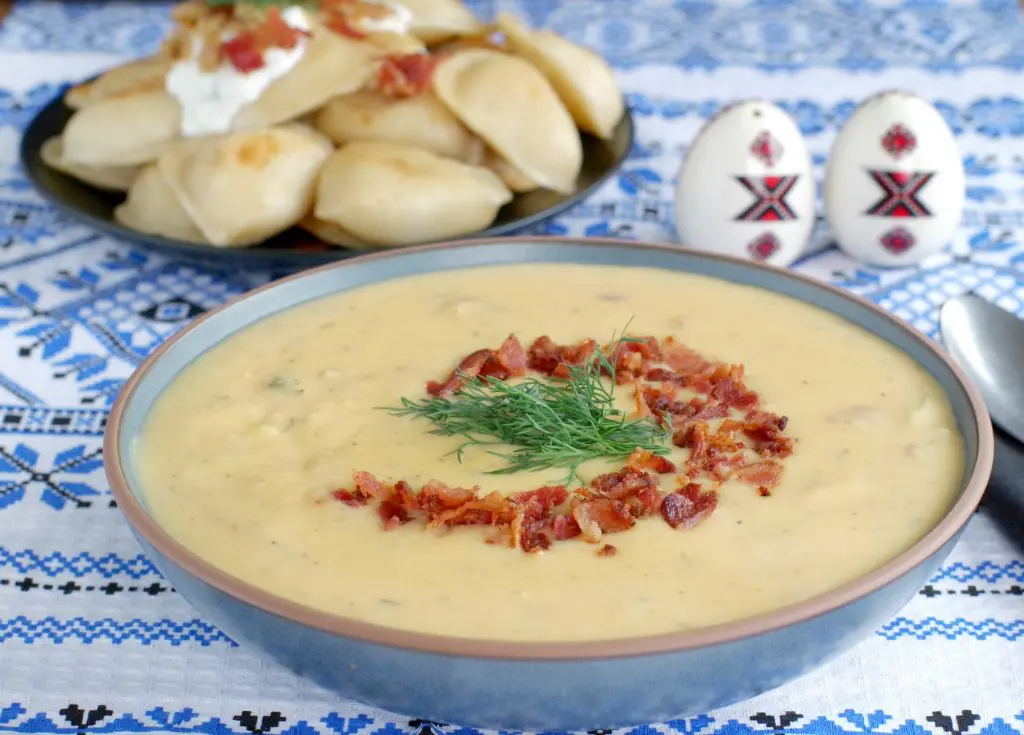 Loaded Pierogi soup with a plate of loaded pierogies in the background