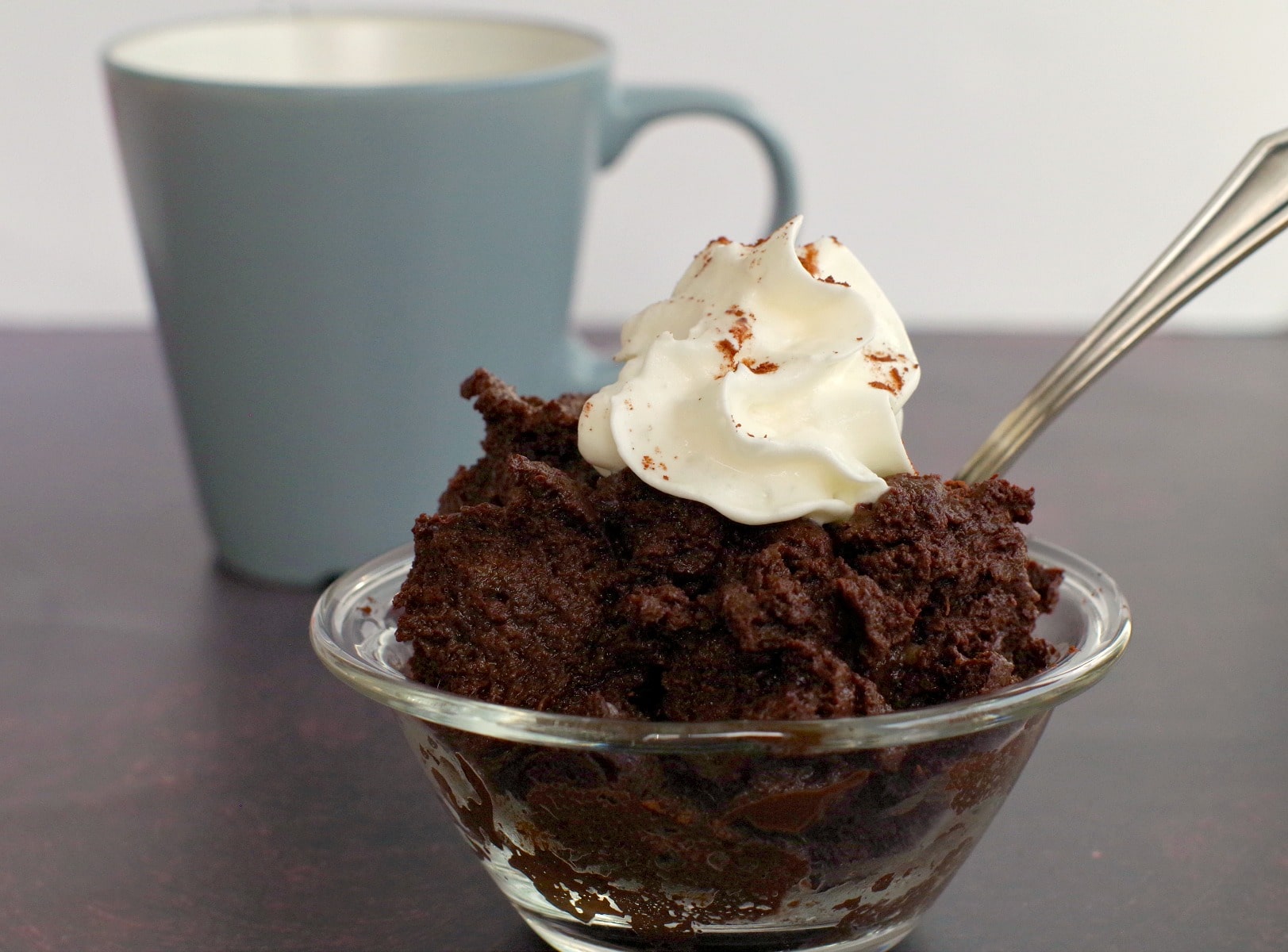 microwave chocolate banana mug cake in a glass bowl