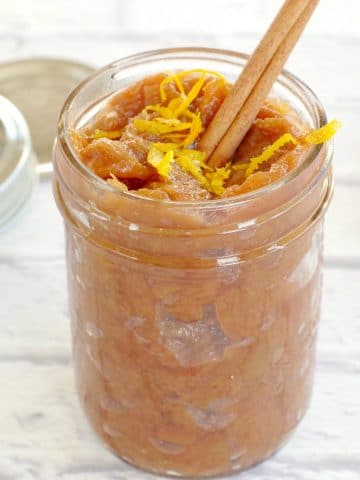 rhubarb compote in jar with cinnamon stick and orange zest