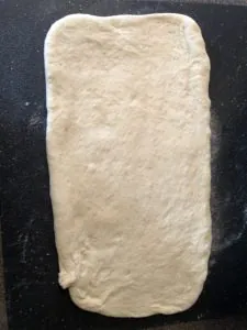 dough rolled in large rectangle