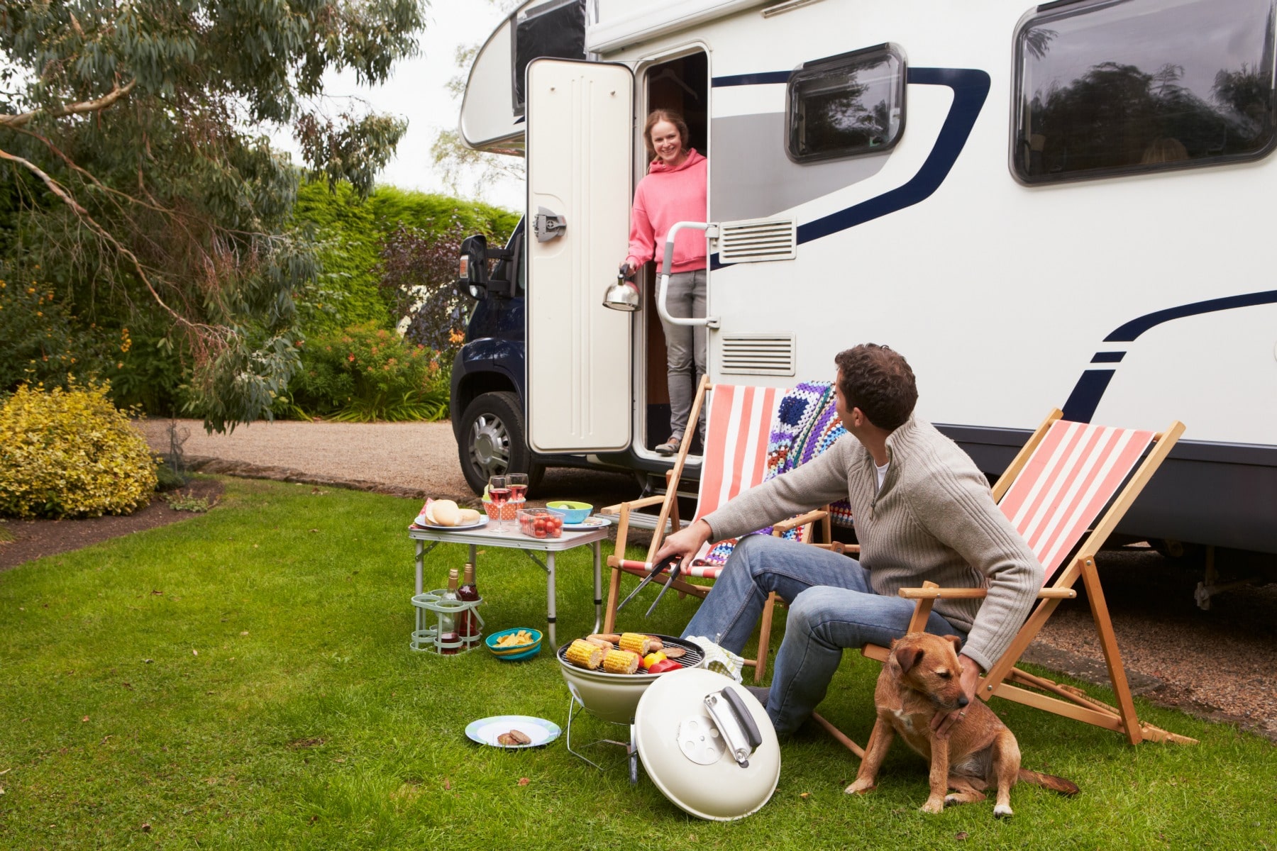 couple preparing food while camping