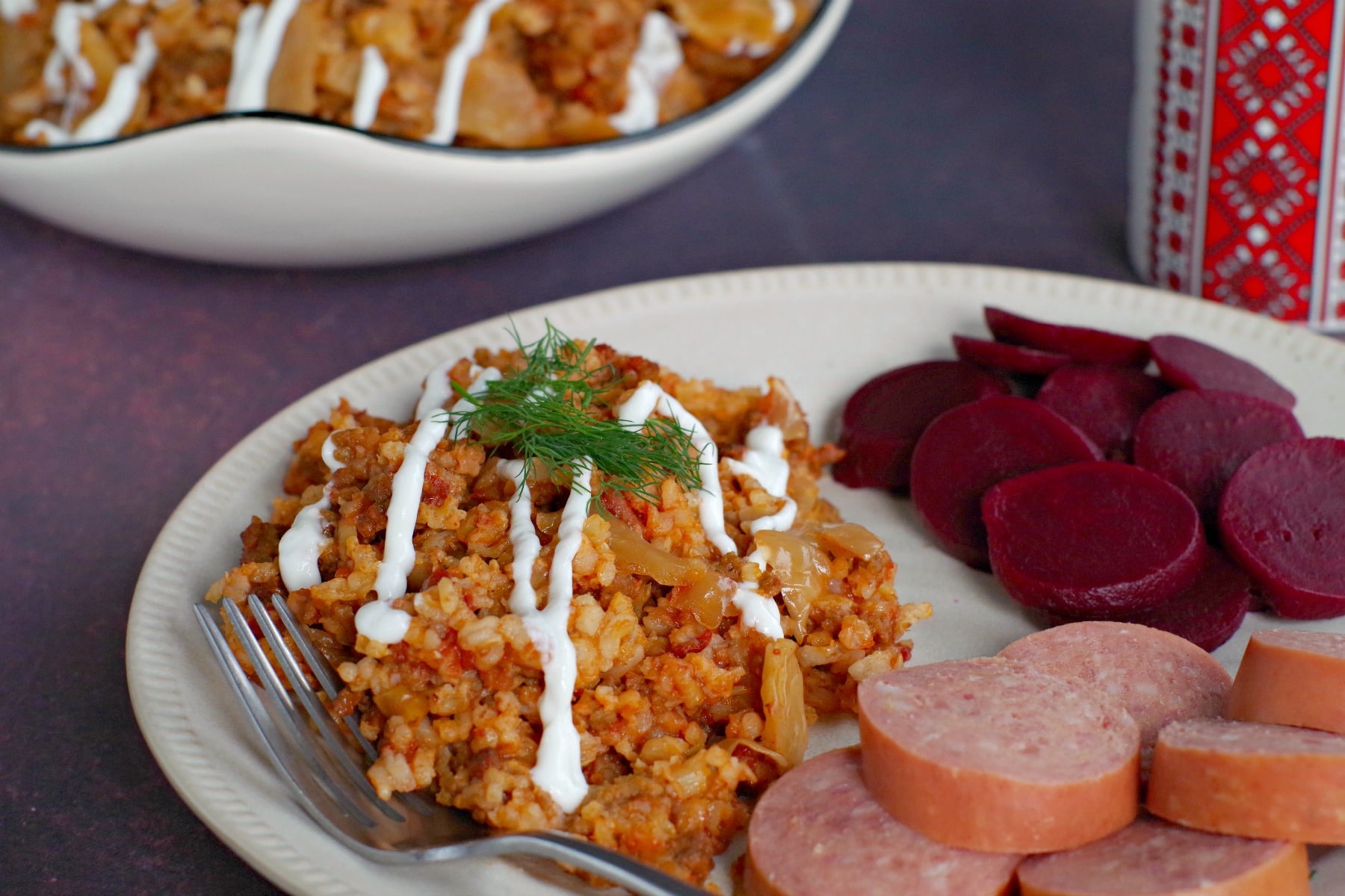 lazy slow cooker cabbage rolls on plate with kielbasa and beets