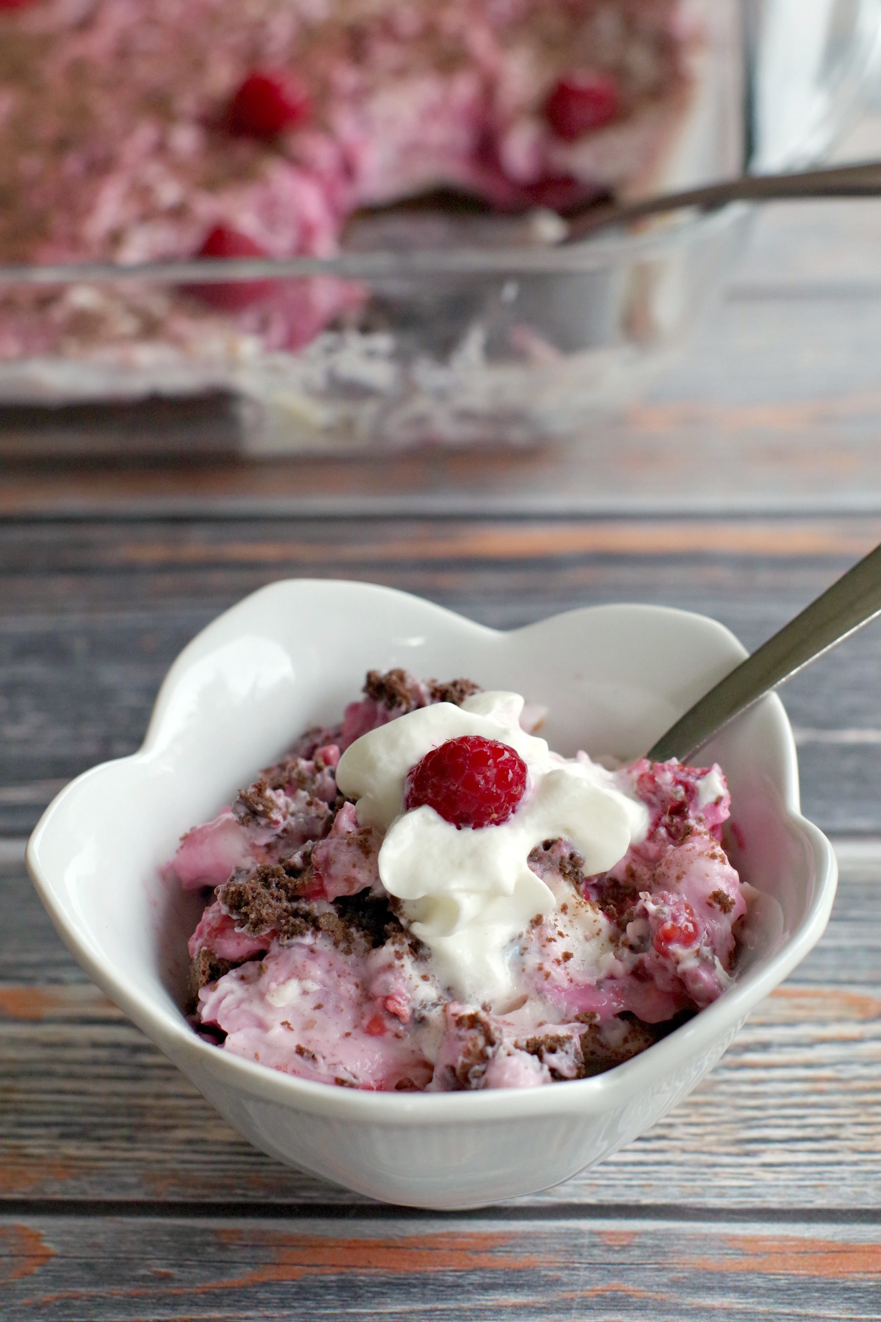 weight watchers white chocolate raspberry cheesecake dessert in white dish with glass dish in background