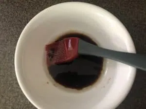 oil and balsamic vinegar mixed together in white bowl