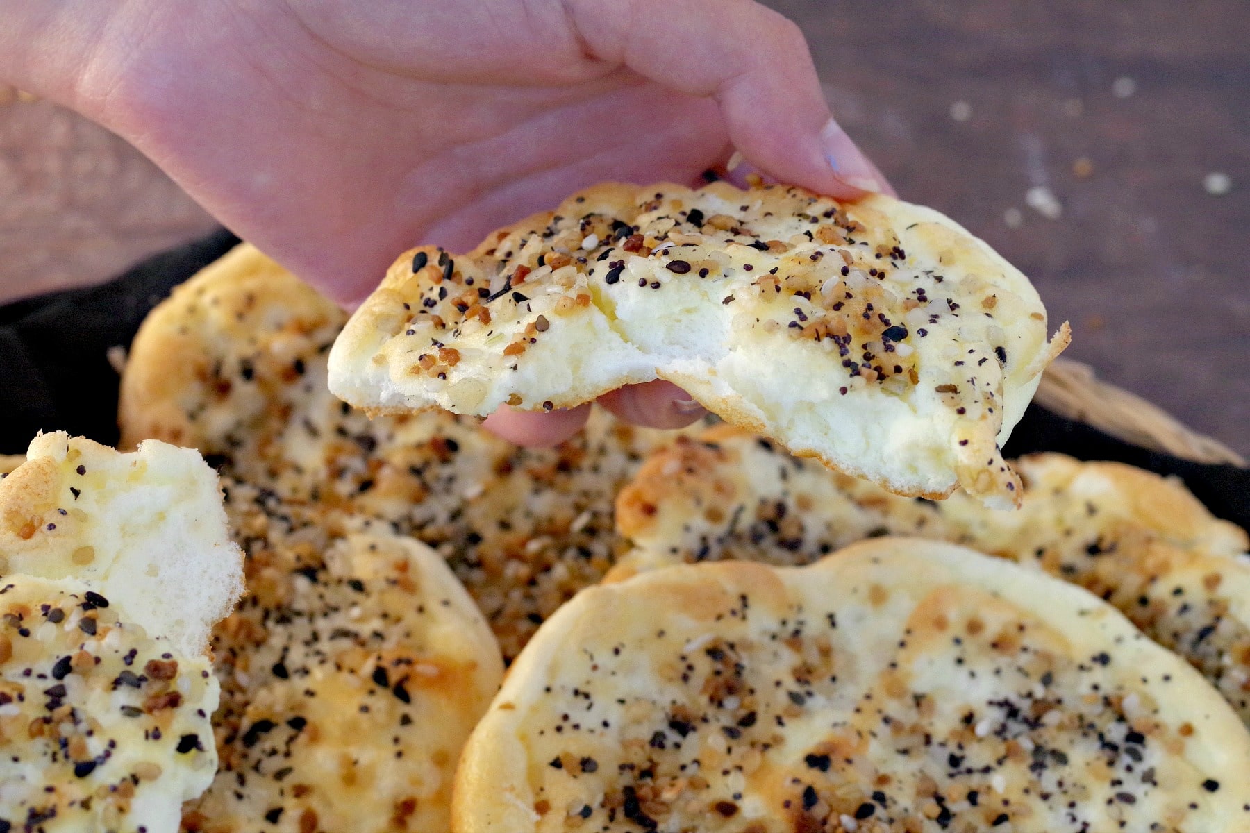 cloud bread cut in half being held up