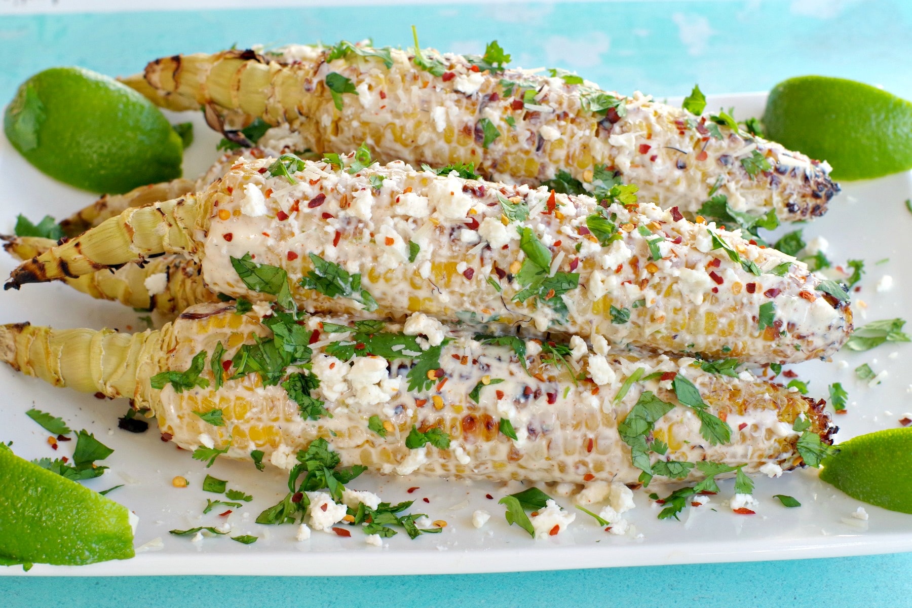 mexican street corn piled on white platter