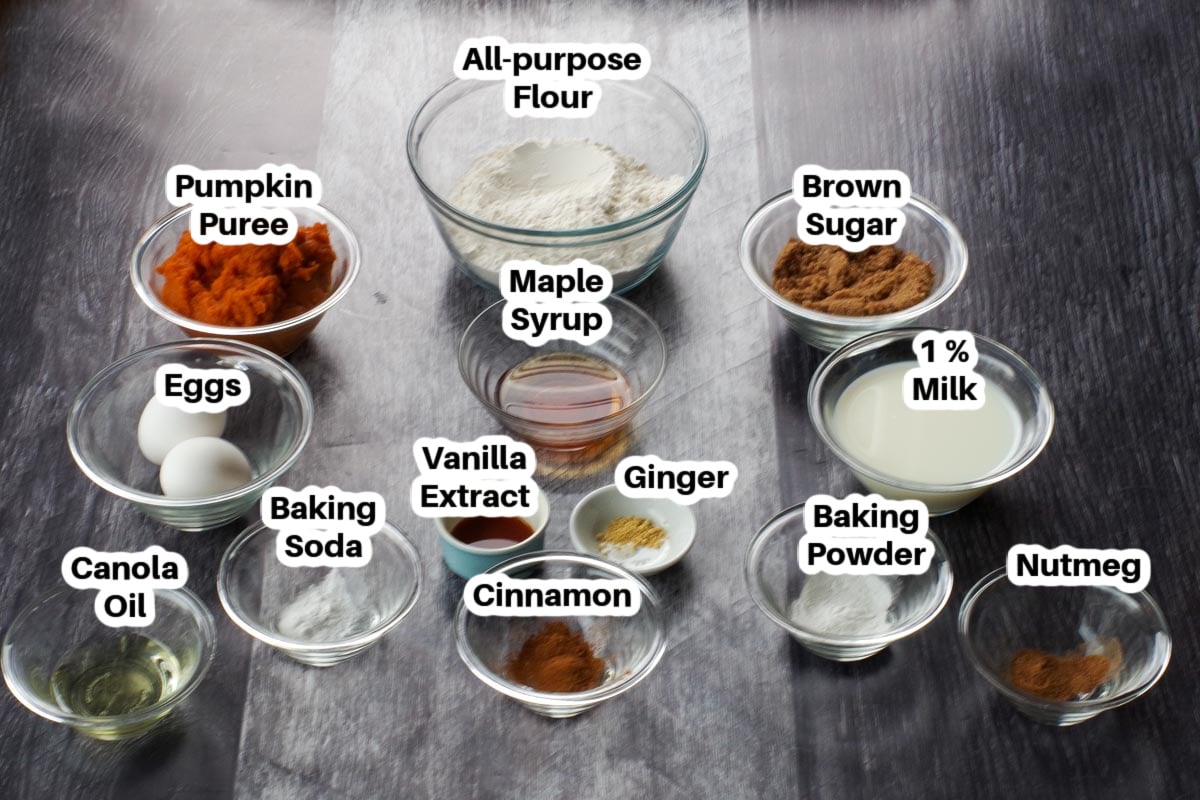 Ingredients in pumpkin sheet pan pancakes in clear glass bowls, labelled