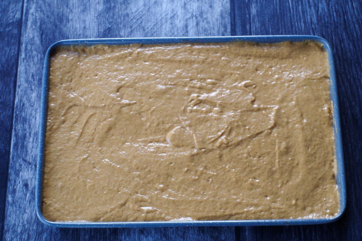 pumpkin pancake batter poured onto sheet pan