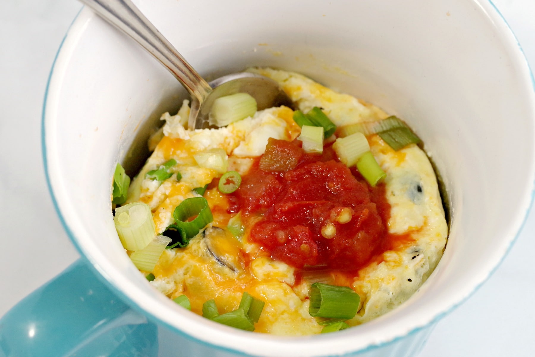 Microwave omelette in a mug with spoon 