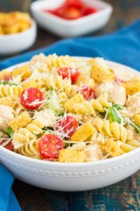 chicken caesar pasta salad in white bowl
