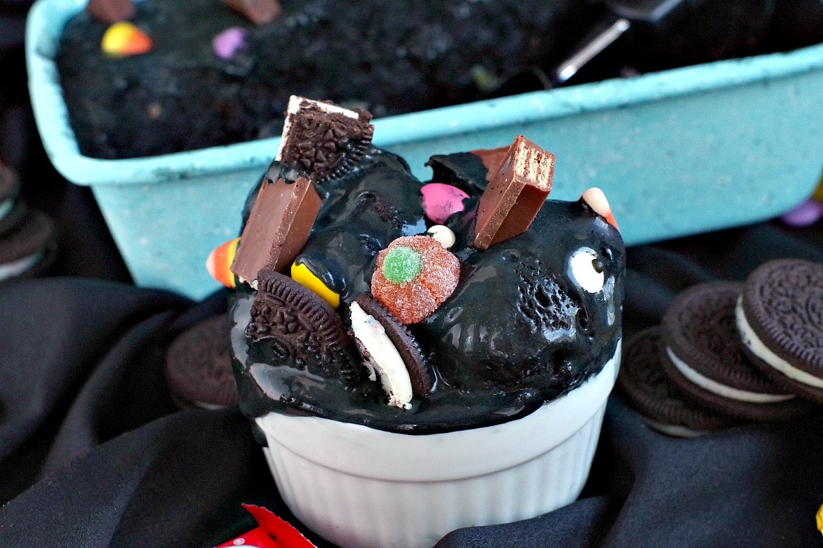 Boo Batter Ice cream in a white dish with container of ice cream in the background