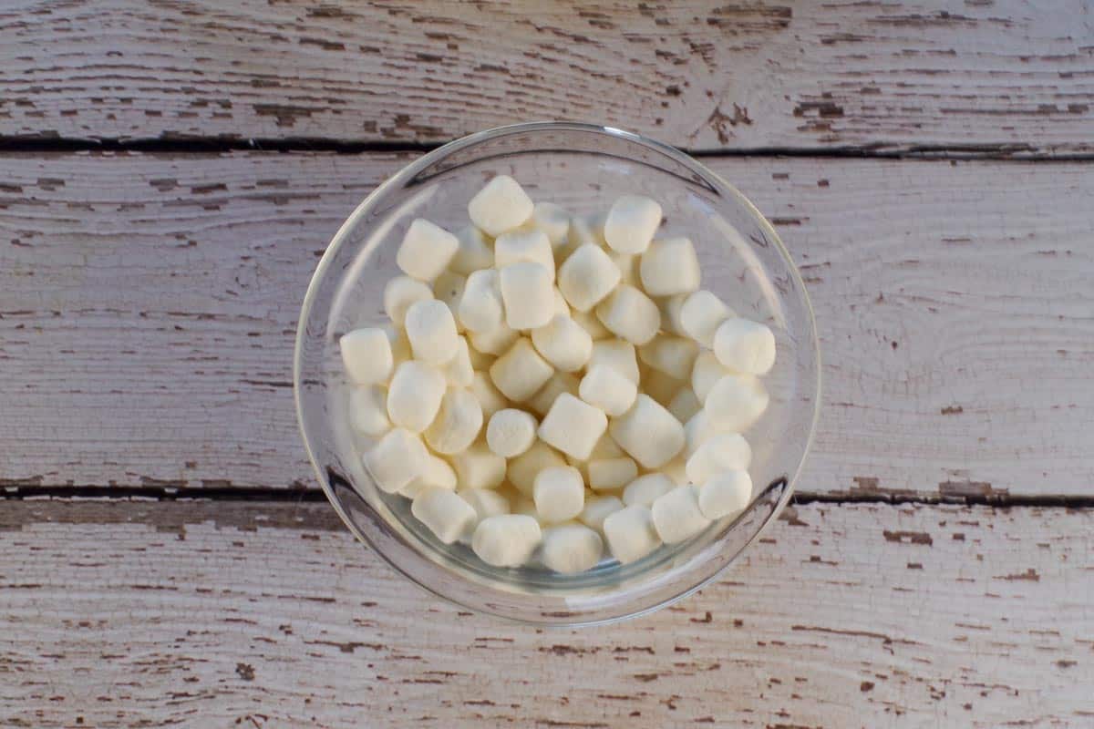 mini marshmallows in a glass bowl with little water.