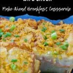 Christmas morning casserole in a blue casserole dish with a slice removed.