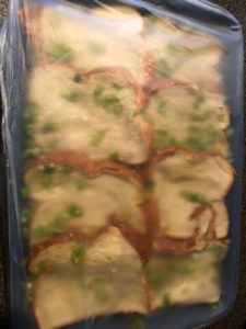 casserole covered with plastic wrap