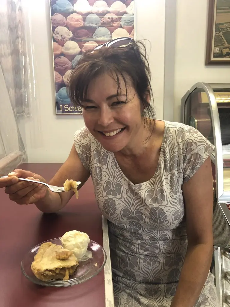 a photo of Terri eating apple pie at an old-fashioned cafe counter