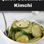Pinterest pin with white text on black background on top and bottom and photo of cucumber kimchi in white bowl in the middle