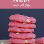 Pinterest pin with beige text on pink background at top and bottom and photo of a stack of 6 strawberry milkshake cookies in the middle